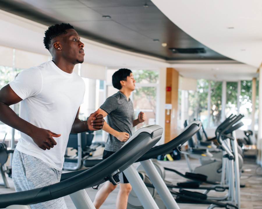 Disinfect your gym with Clear Gear Spray - Man working out at gym